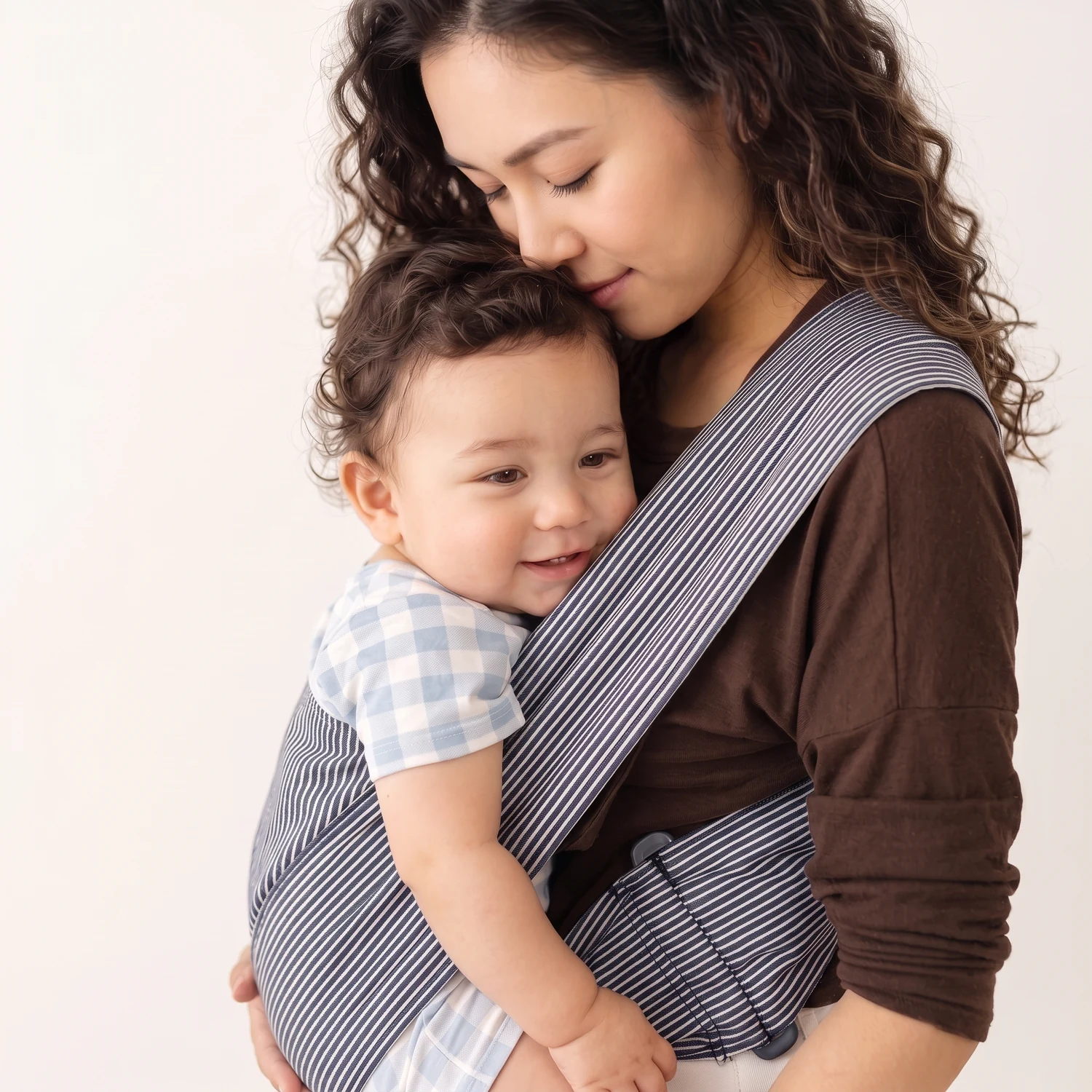 At home or out for a gentle stroll, keep your little one close.